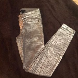 Metallic silver jeans with subtle animal print